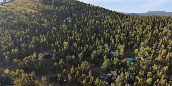 Image 4: Aerial Looking at Property with Mount Pence as a Backdrop