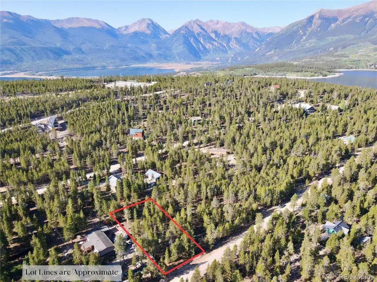 Image 1: Aerial view of property and surrounding area featuring property parcel outlined and a water and mountain view Image 1: Aerial view of property and surrounding area featuring property parcel outlined and a water and mountain view