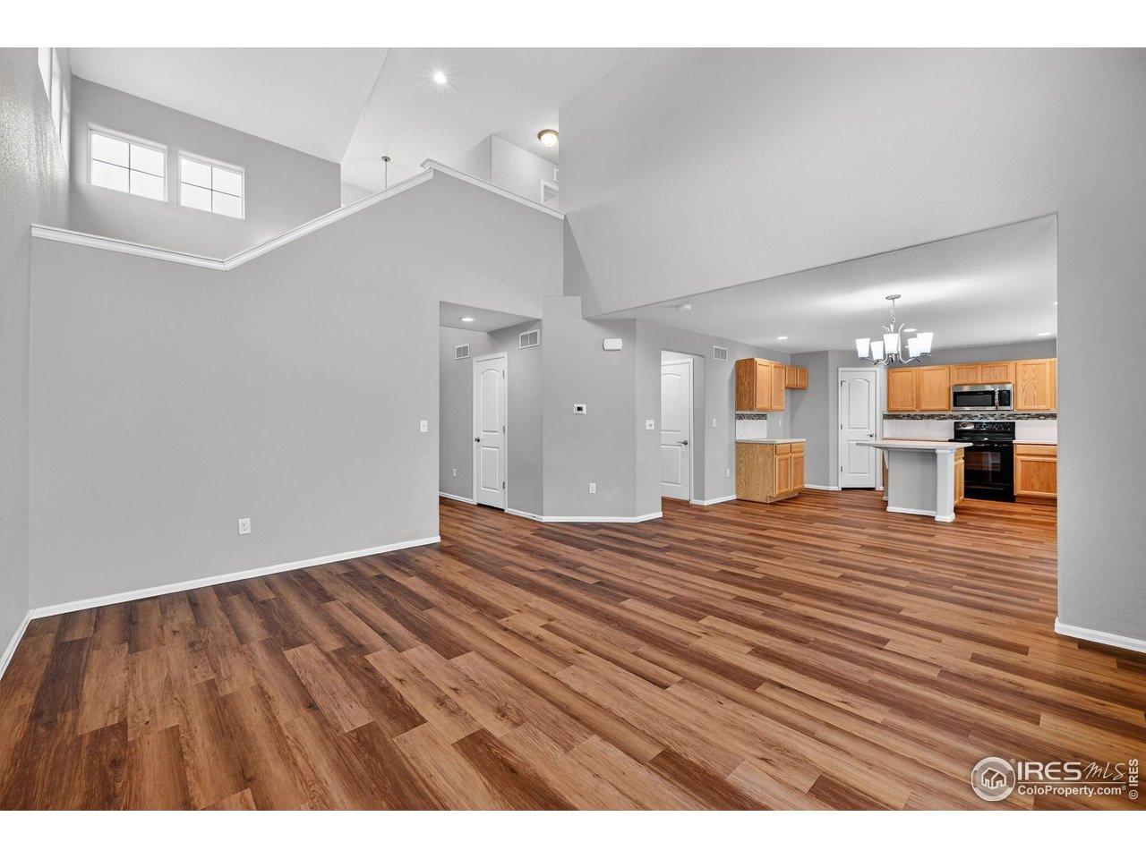 Image 4: New luxury vinyl plank flooring enhances the open-concept main level. Image 4: New luxury vinyl plank flooring enhances the open-concept main level.