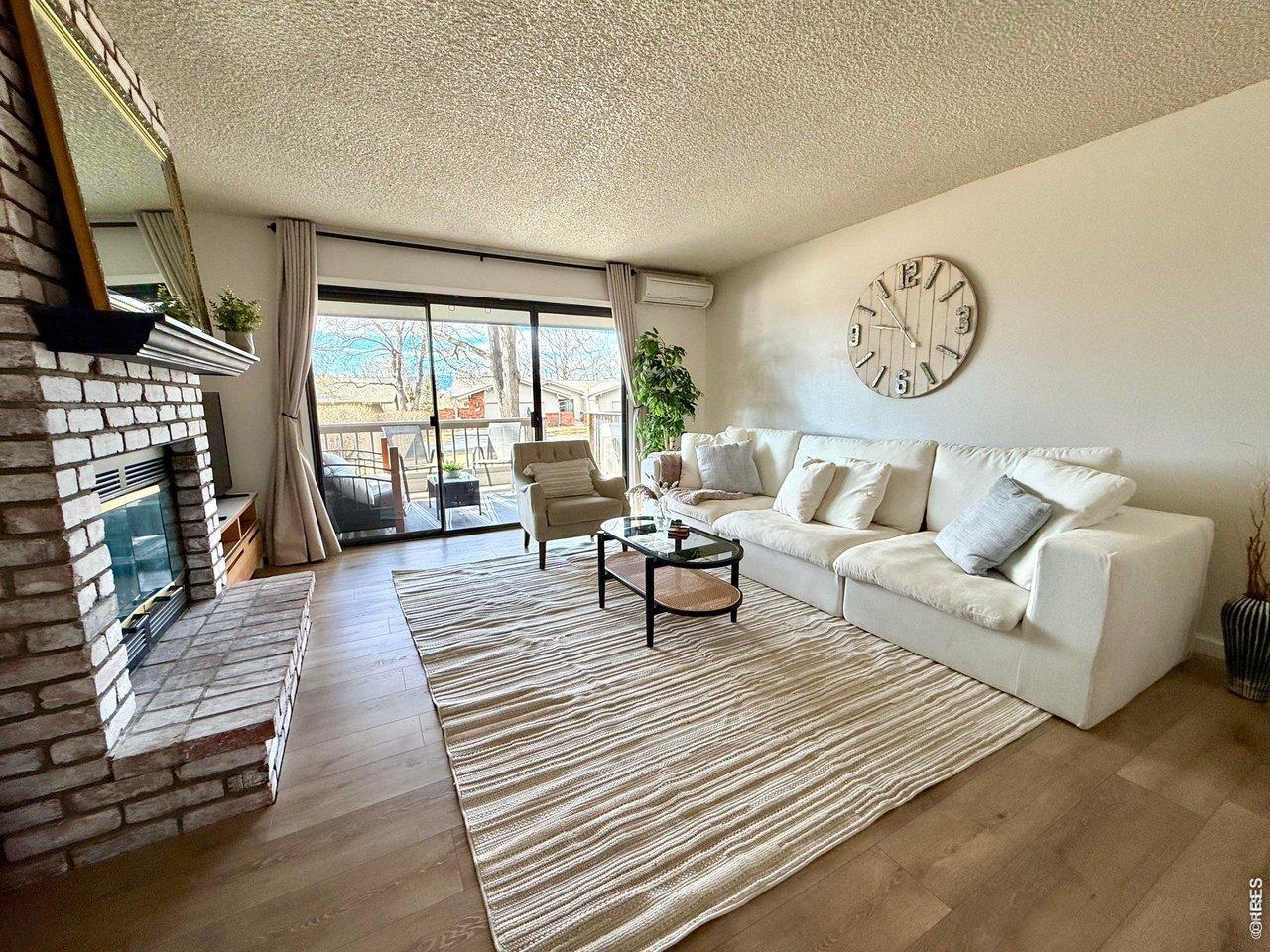 Image 1: Open concept family room with fireplace and ample natural light