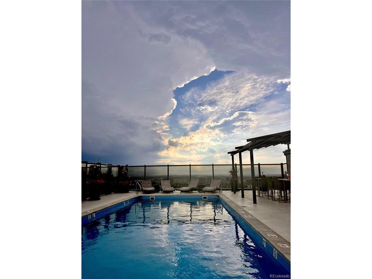 Image 3: rooftop swimming pool overlooking the front range and rocky mountains