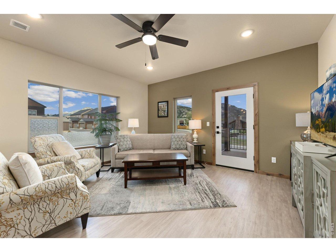 Image 4: Living Room with large windows and access to balcony