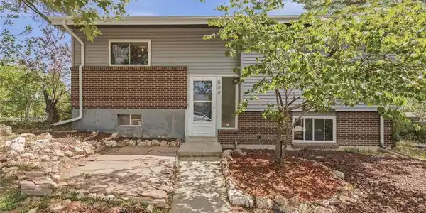 Image 4: Classic brick and siding split-level at 804 S. Queen Way, Lakewood CO 80226. Corner lot, mature landscaping, and a welcoming front entry. Image 4: Classic brick and siding split-level at 804 S. Queen Way, Lakewood CO 80226. Corner lot, mature landscaping, and a welcoming front entry.