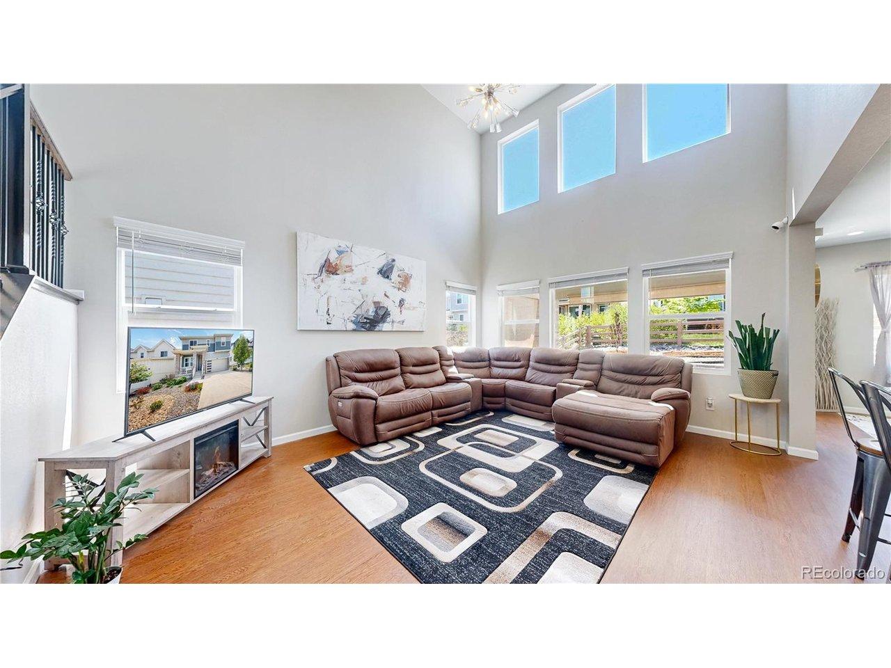 Image 2: Great room with a volume ceiling, clerestory windows for added natural light, and open to the kitchen. Perfect for entertaining and everyday living. Image 2: Great room with a volume ceiling, clerestory windows for added natural light, and open to the kitchen. Perfect for entertaining and everyday living.