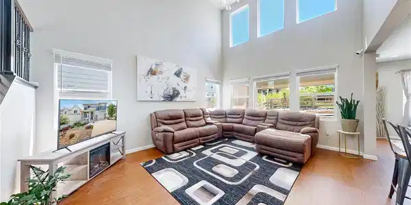 Image 2: Great room with a volume ceiling, clerestory windows for added natural light, and open to the kitchen. Perfect for entertaining and everyday living. Image 2: Great room with a volume ceiling, clerestory windows for added natural light, and open to the kitchen. Perfect for entertaining and everyday living.