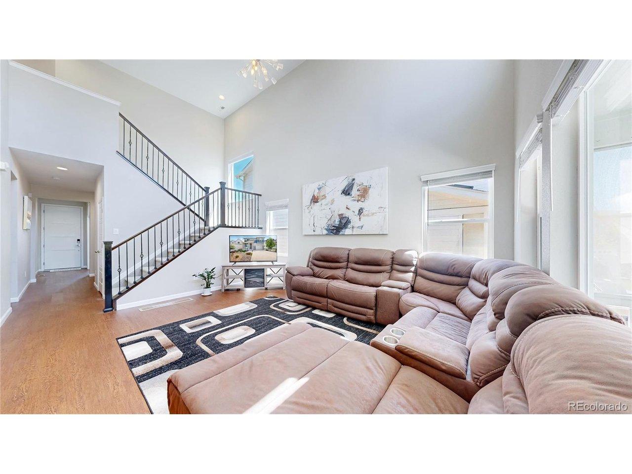 Image 3: Great room with a 2 story volume ceiling and extra durable vinyl plank flooring Image 3: Great room with a 2 story volume ceiling and extra durable vinyl plank flooring