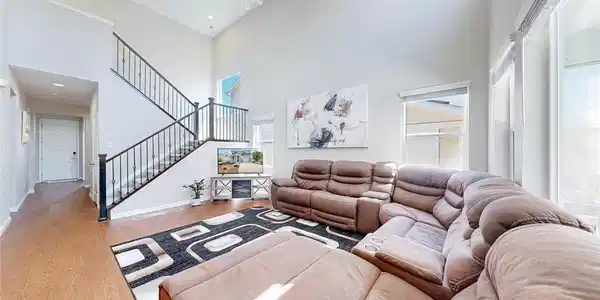 Image 3: Great room with a 2 story volume ceiling and extra durable vinyl plank flooring Image 3: Great room with a 2 story volume ceiling and extra durable vinyl plank flooring