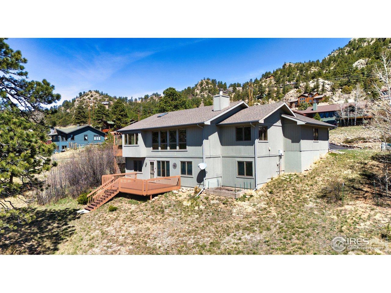 Image 1: Charming mountain home surrounded by pines, offering warm natural light, peaceful views, and a welcoming deck perfect for morning coffee or evening sunsets. Image 1: Charming mountain home surrounded by pines, offering warm natural light, peaceful views, and a welcoming deck perfect for morning coffee or evening sunsets.