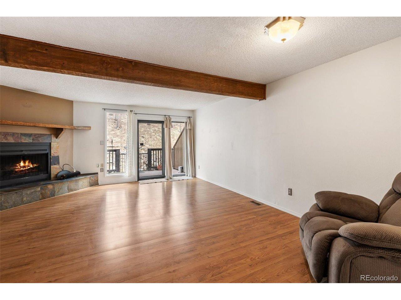 Image 2: Living Room with fireplace and back porch. Image 2: Living Room with fireplace and back porch.