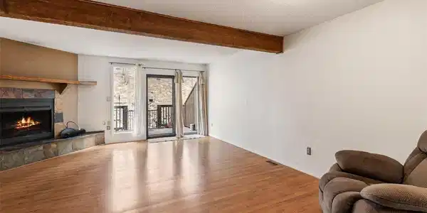 Image 2: Living Room with fireplace and back porch. Image 2: Living Room with fireplace and back porch.