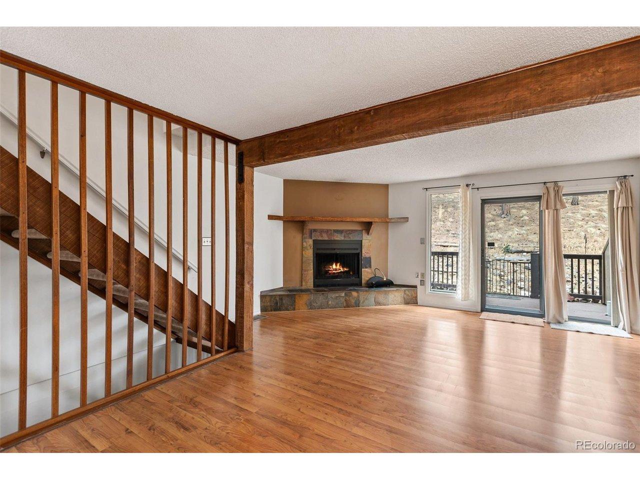 Image 3: Living Room with fireplace and back porch. Image 3: Living Room with fireplace and back porch.