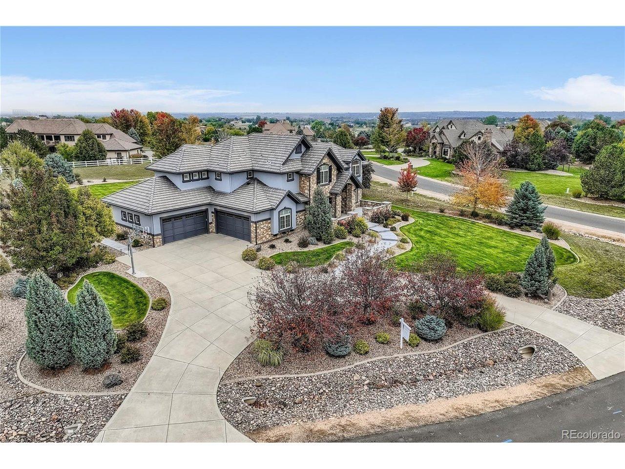 Image 2: Oversized 4-car garage offering ample space for vehicles, storage, and hobbies. Just off the wide driveway, a built-in basketball hoop is perfect for casual games or practicing your shot at home.