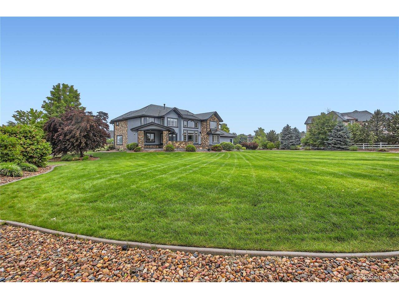 Image 4: Extensive landscaped yard perfect for football, soccer, baseball or a host of outdoor activities, with ample space for the addition of future pool and sports court, further enhancing the outdoor living experience