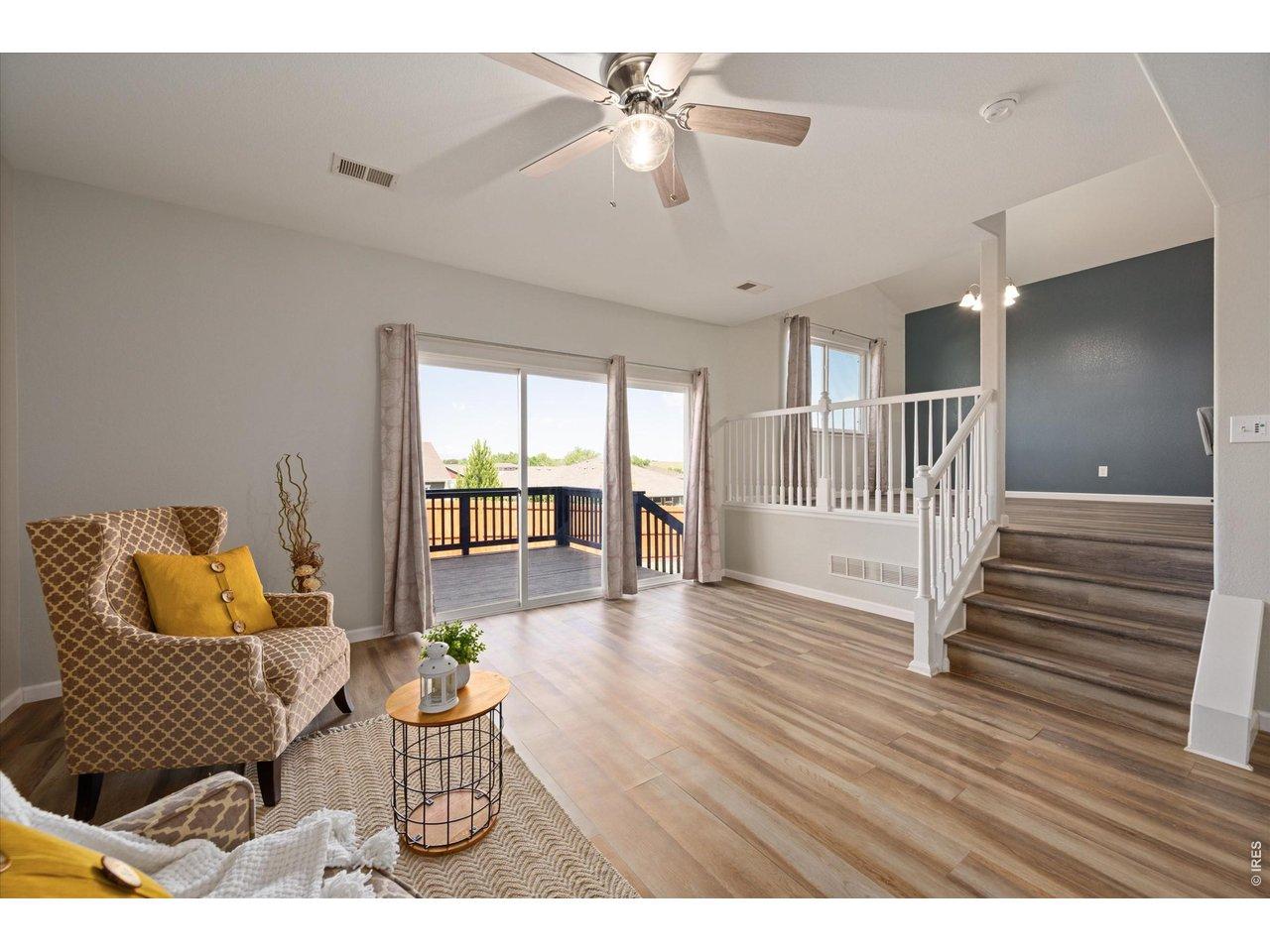 Image 3: Living area with oversized sliding door. This home is flooded with natural light Image 3: Living area with oversized sliding door. This home is flooded with natural light