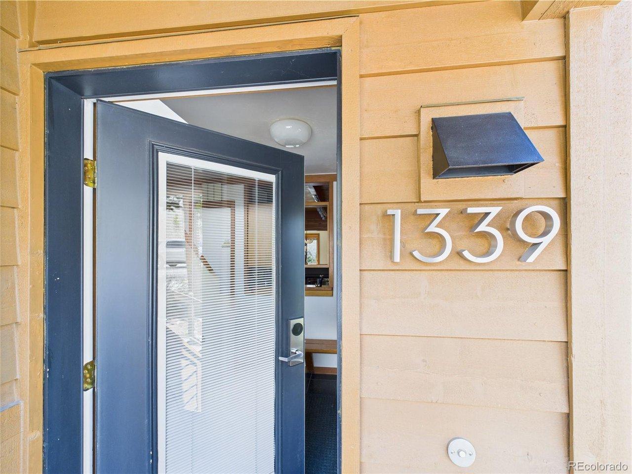 Image 2: Welcome to this townhome-style condo featuring a private entrance for added convenience and privacy