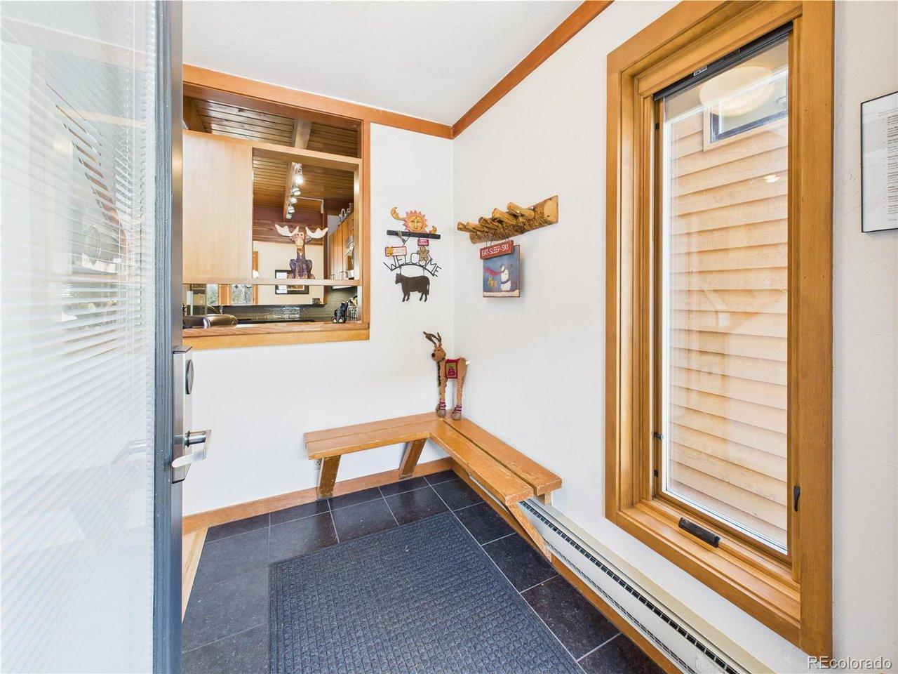 Image 3: Convenient entry with bench and gear hooks for all your mountain adventures.