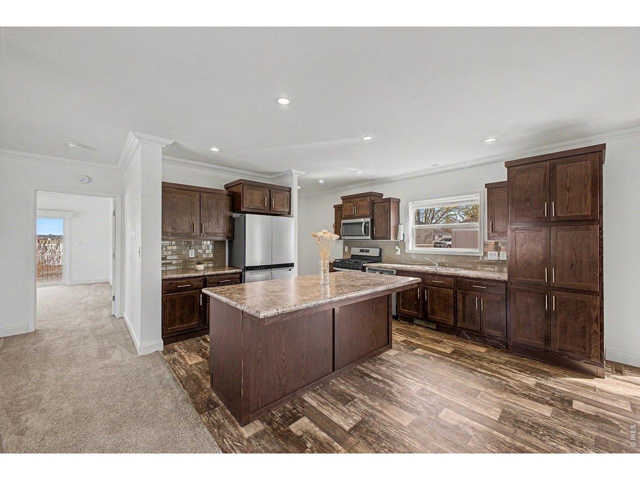 Image 1: Convenient Breakfast bar countertop hangs over for stool use.