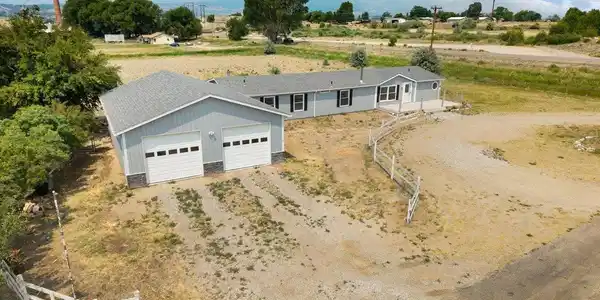 Image 2: Garage & main home. Image 2: Garage & main home.