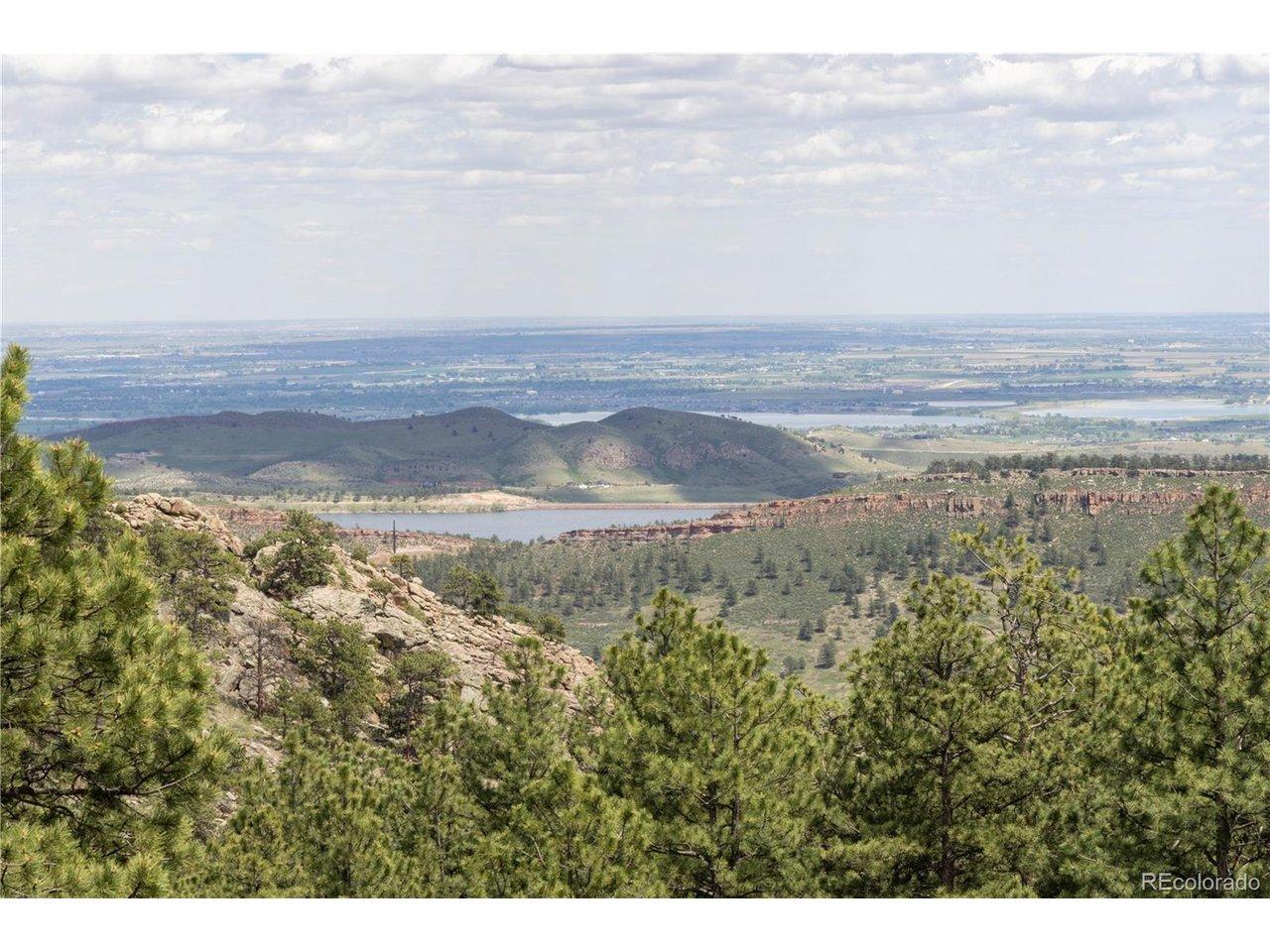 Image 1: Panoramic Rocky Mountain views from 84-acre Colorado mountain land parcel - Longs Peak visible - Lyons CO improved land for sale with seller financing Image 1: Panoramic Rocky Mountain views from 84-acre Colorado mountain land parcel - Longs Peak visible - Lyons CO improved land for sale with seller financing
