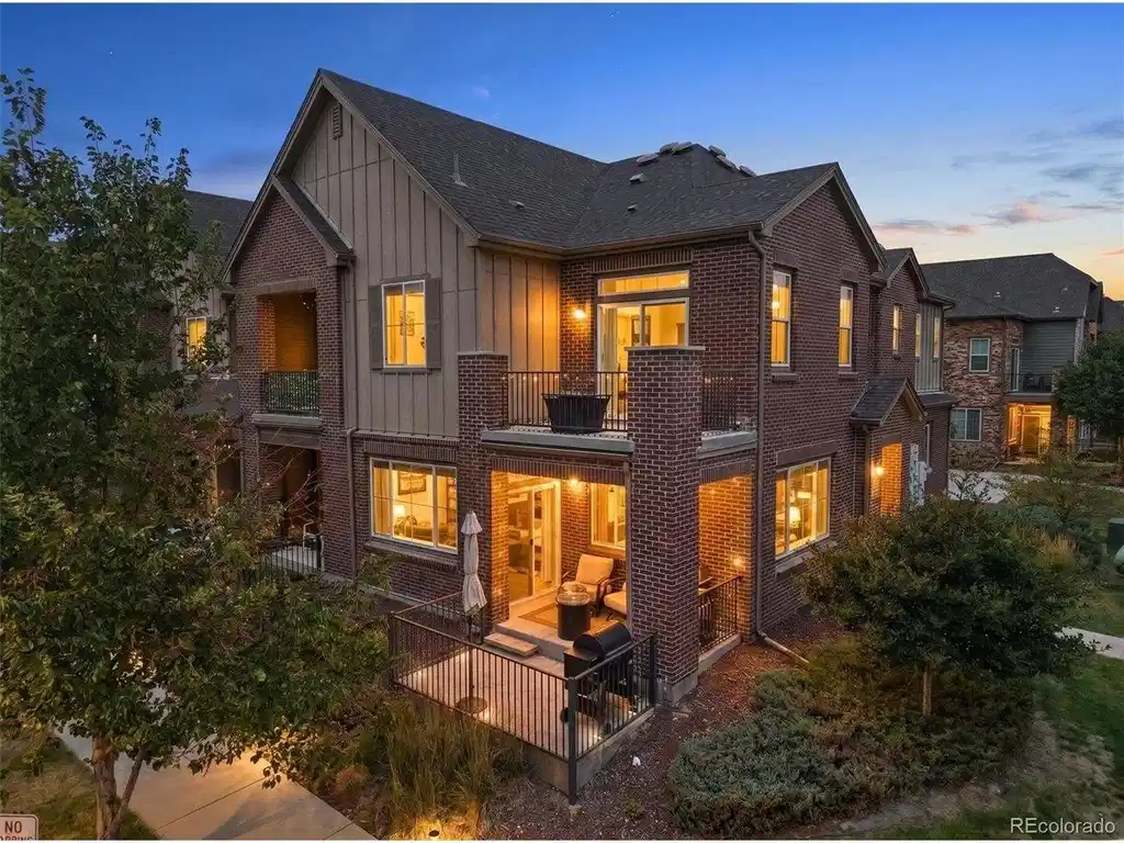 Image 1: This home shines at twilight with warm exterior lighting and timeless curb appeal Image 1: This home shines at twilight with warm exterior lighting and timeless curb appeal
