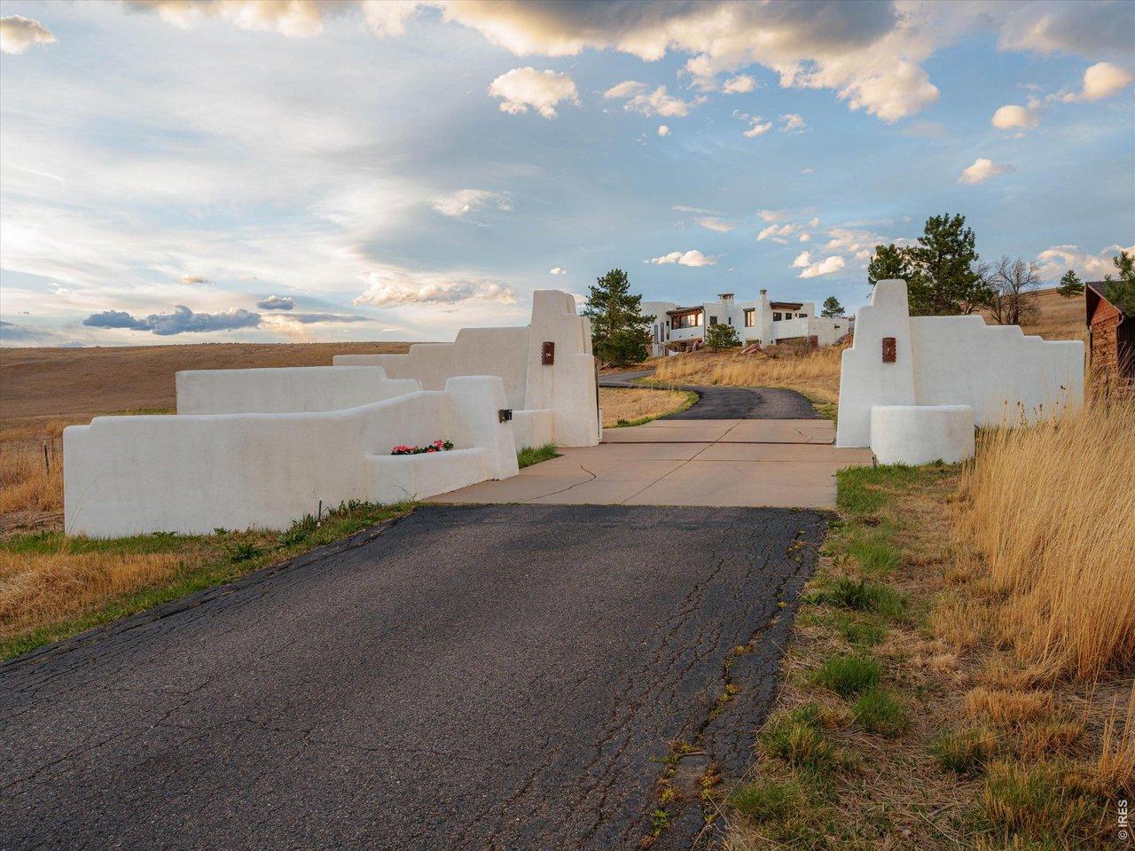 Image 2: Behind a private gated entrance, the residence unfolds across approximately 5,800 square feet.