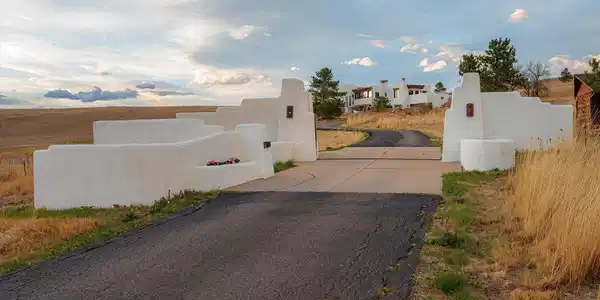 Image 2: Behind a private gated entrance, the residence unfolds across approximately 5,800 square feet.