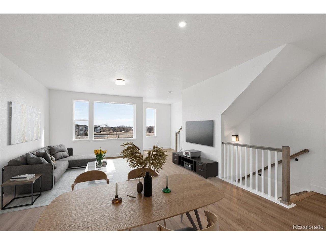 Image 2: Light filled open concept main level. Virtually staged.