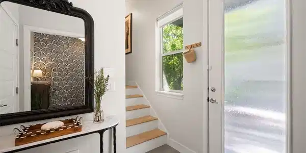 Image 3: Entryway with front door and garage access. Image 3: Entryway with front door and garage access.