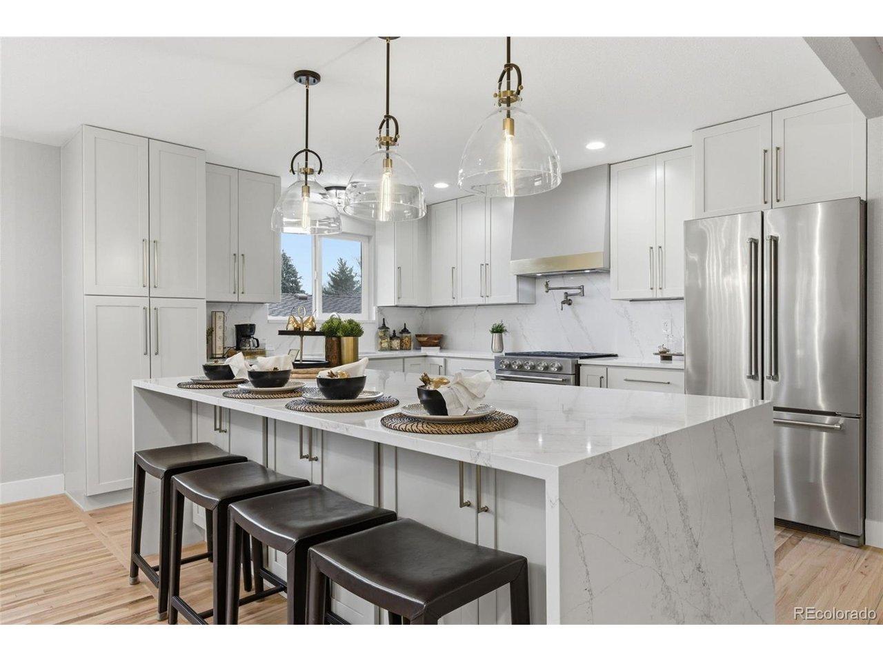 Image 2: Stunning quartz waterfall island with seating for four, premium finishes, and abundant workspace. Image 2: Stunning quartz waterfall island with seating for four, premium finishes, and abundant workspace.