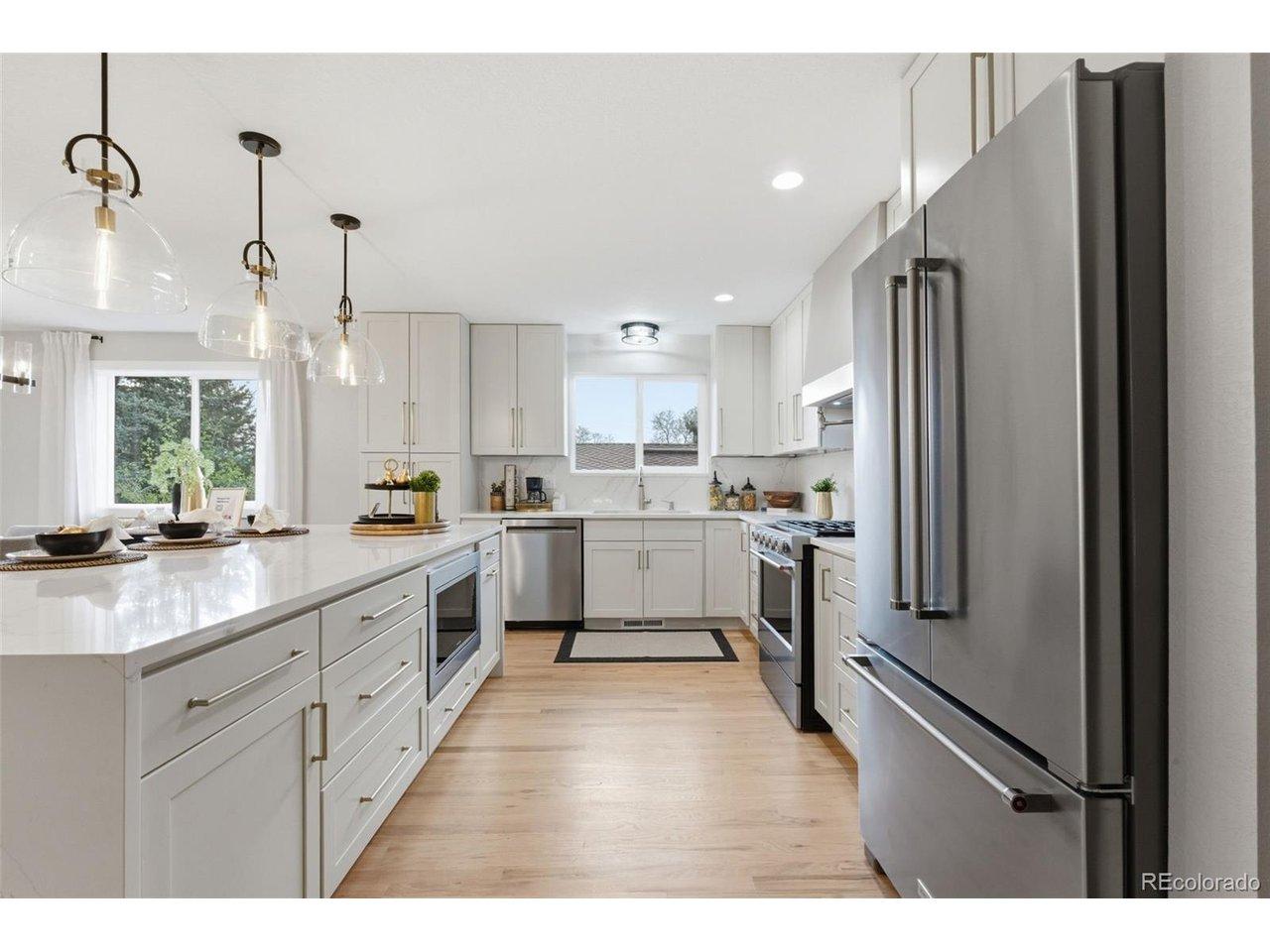 Image 3: Beautifully remodeled kitchen featuring custom cabinetry, stainless steel appliances, and generous storage. Image 3: Beautifully remodeled kitchen featuring custom cabinetry, stainless steel appliances, and generous storage.