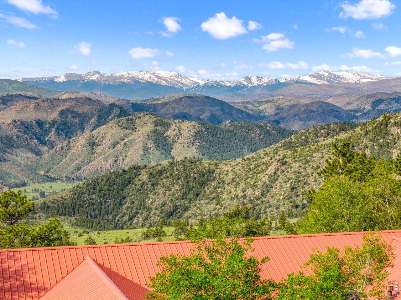 Image 2: Views all the way to snow capped peaks