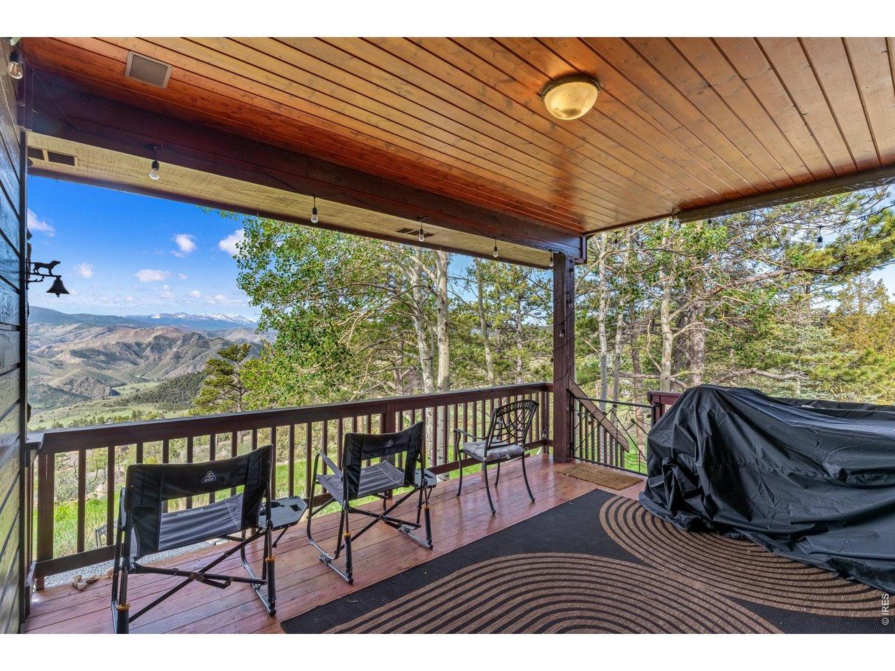 Image 3: Large covered deck is the perfect spot to relax year-round. Shade in the summer and south facing offers warmth in the winter