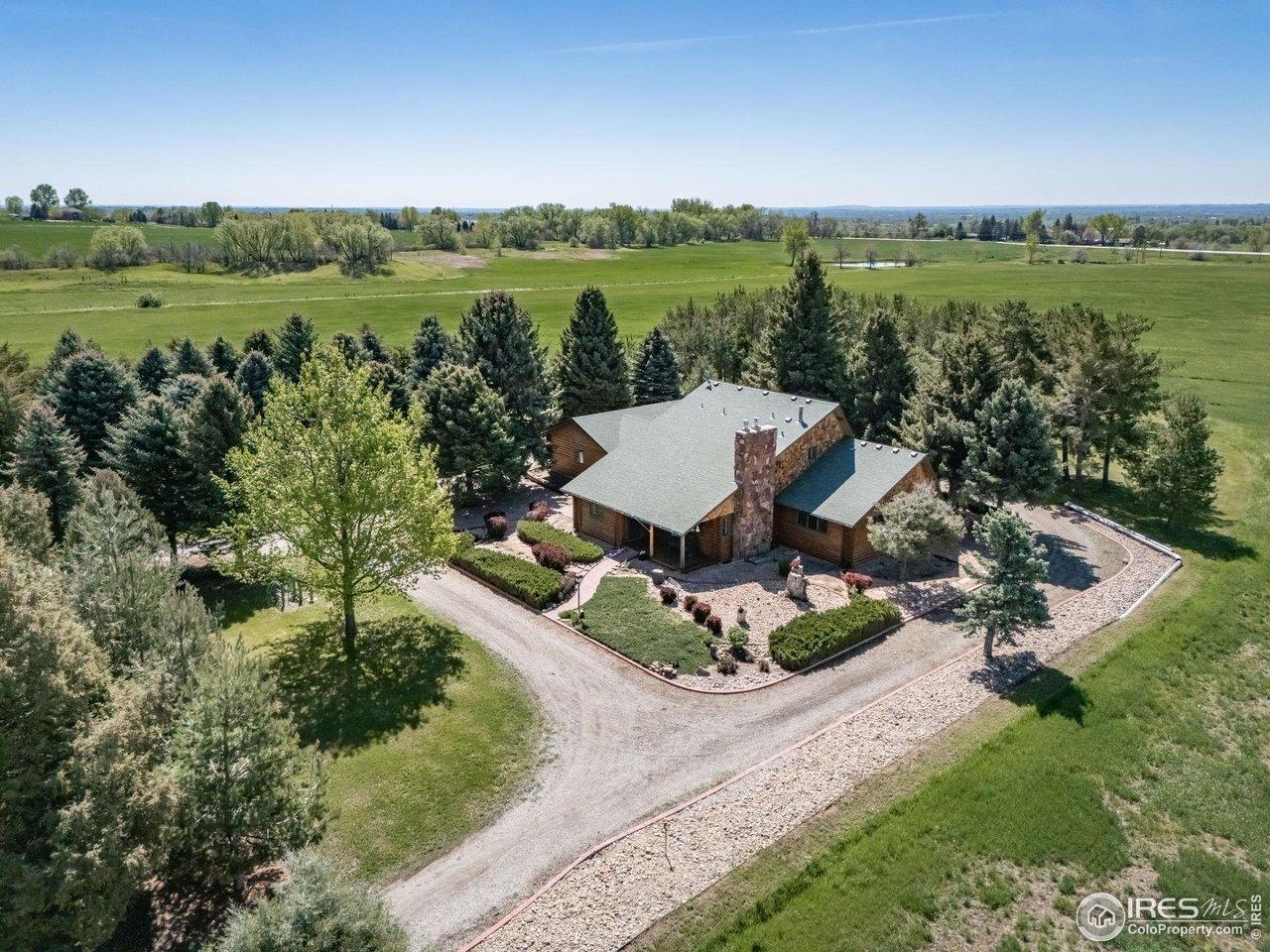 Image 2: Aerial of home with rows of trees Image 2: Aerial of home with rows of trees