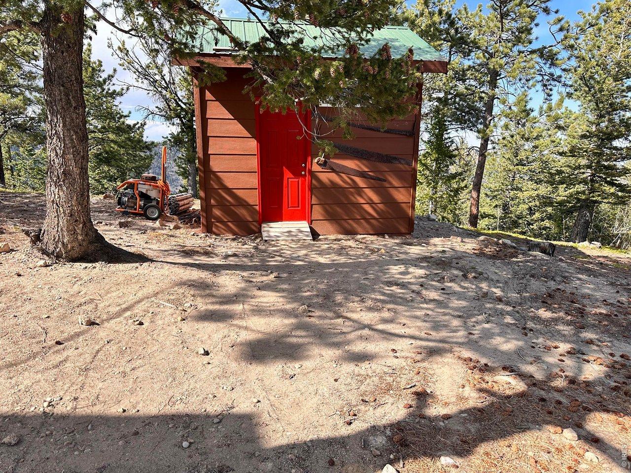 Image 3: Storage shed with metal roof