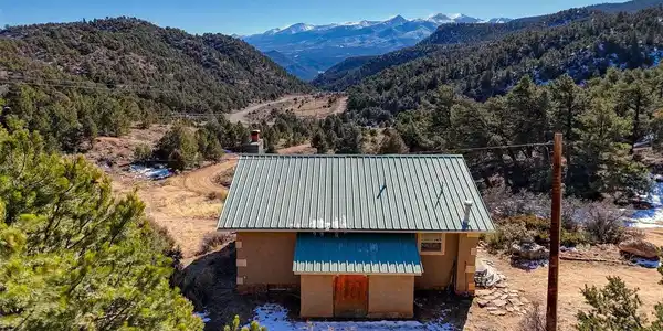 Image 4: Home from the rear facing the Sangre de Cristo Mountains Image 4: Home from the rear facing the Sangre de Cristo Mountains