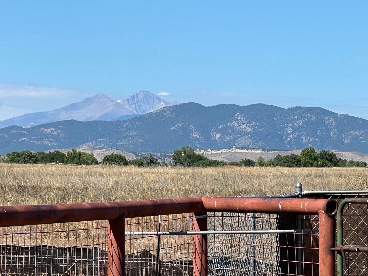 Image 1: Longs Peak and Mt. Meeker are front and center as you look to the west from the back of the home