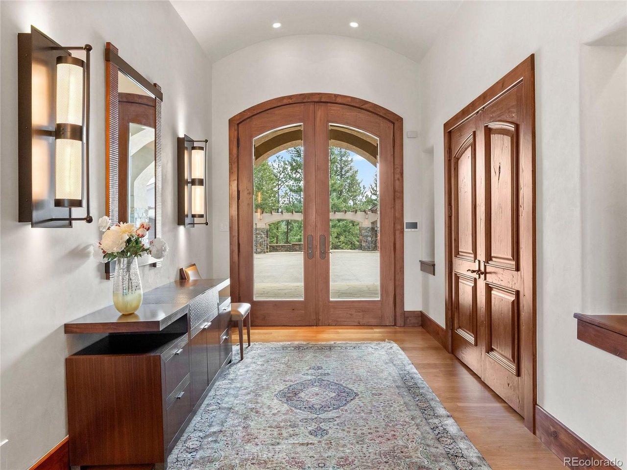 Image 3: Step into timeless elegance through a grand entrance that sets the tone for the entire home