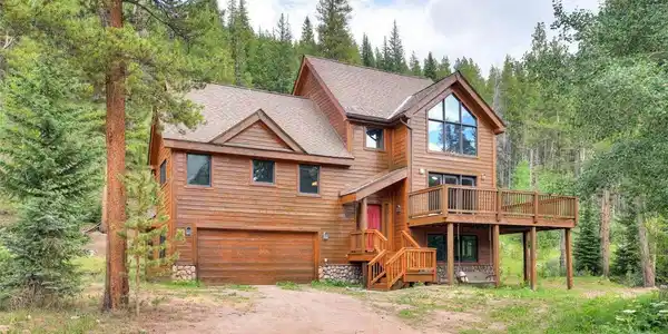 Image 2: Exterior of home featuring attached garage and amazing deck