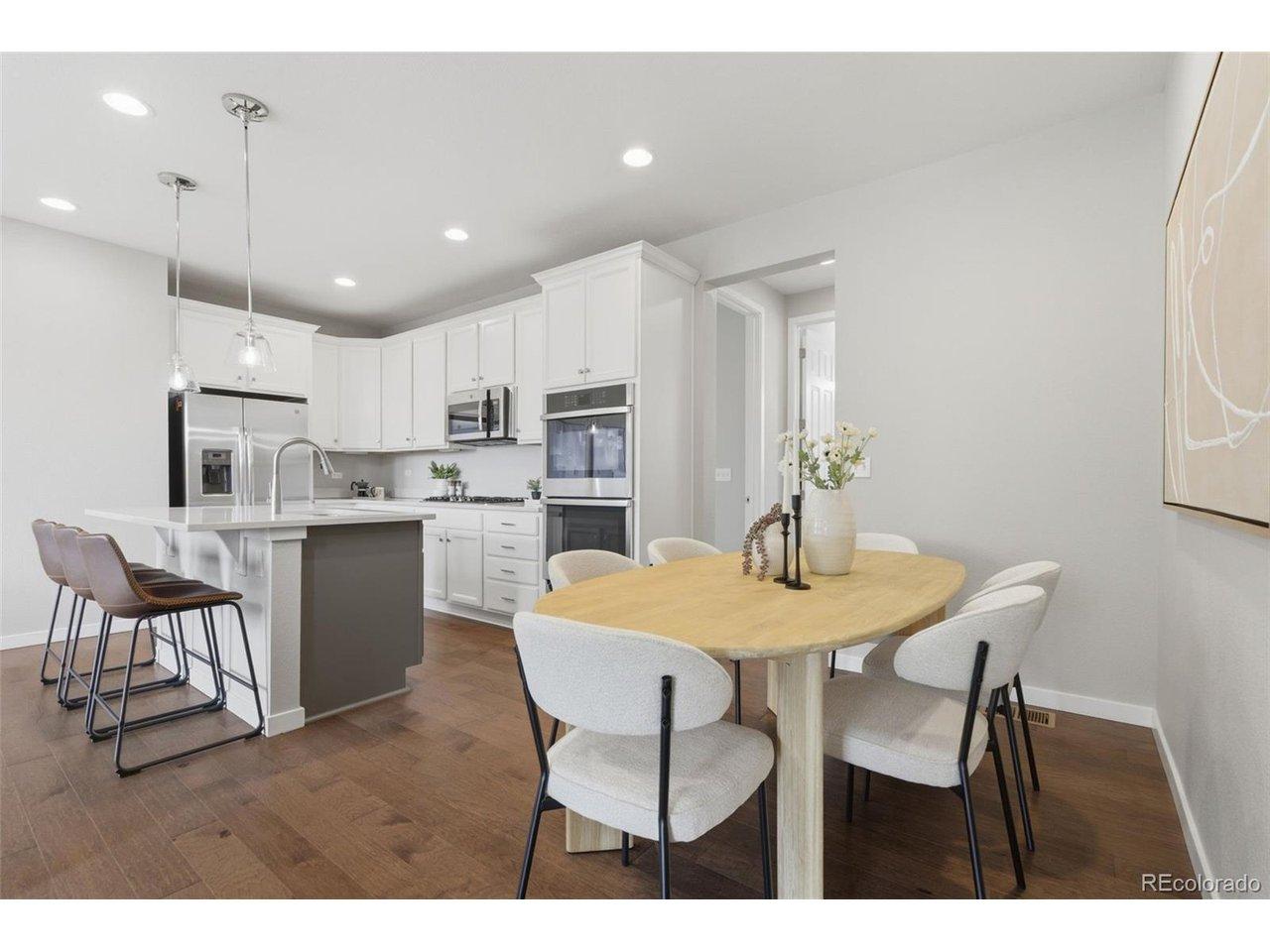 Image 2: Open kitchen and dining space with large center island