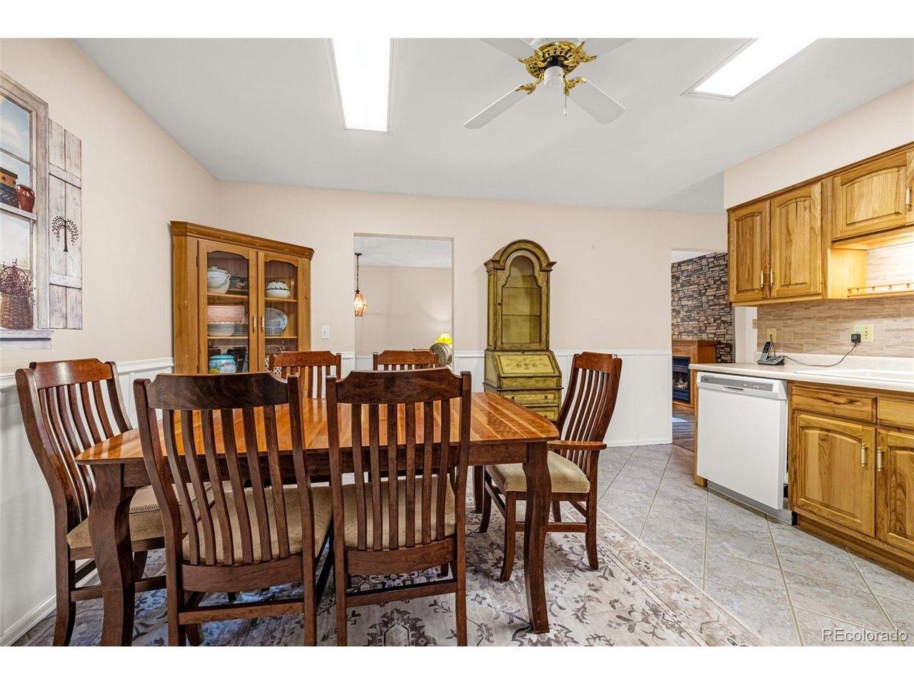 Image 3: Bright and roomy with wainscoting details makes this kitchen perfect for get togethers. Smooth cooktop conventional range with ample workspace and storage with access to the covered deck makes hosting even easier. Image 3: Bright and roomy with wainscoting details makes this kitchen perfect for get togethers. Smooth cooktop conventional range with ample workspace and storage with access to the covered deck makes hosting even easier.