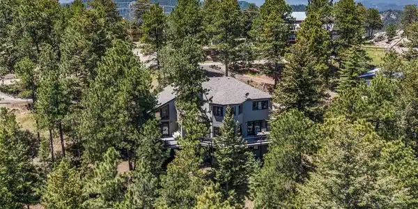 Image 3: Spacious treed and usable lot with a deck with mountain views. Image 3: Spacious treed and usable lot with a deck with mountain views.