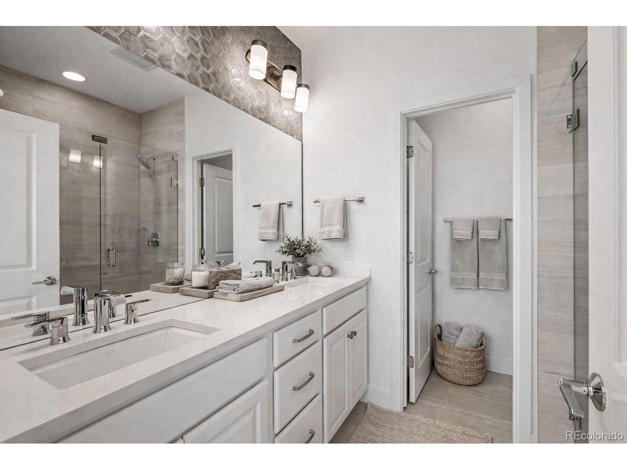 Image 4: Large ensuite with upgraded tile and  frameless Euro shower. Virtually Staged.