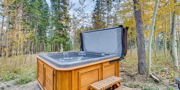 Image 2: Private hot tub surrounded by nature