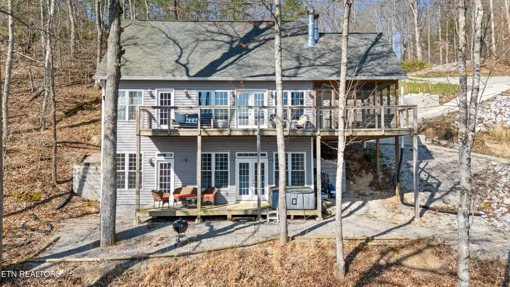 Image 1: View of the house from the lake
