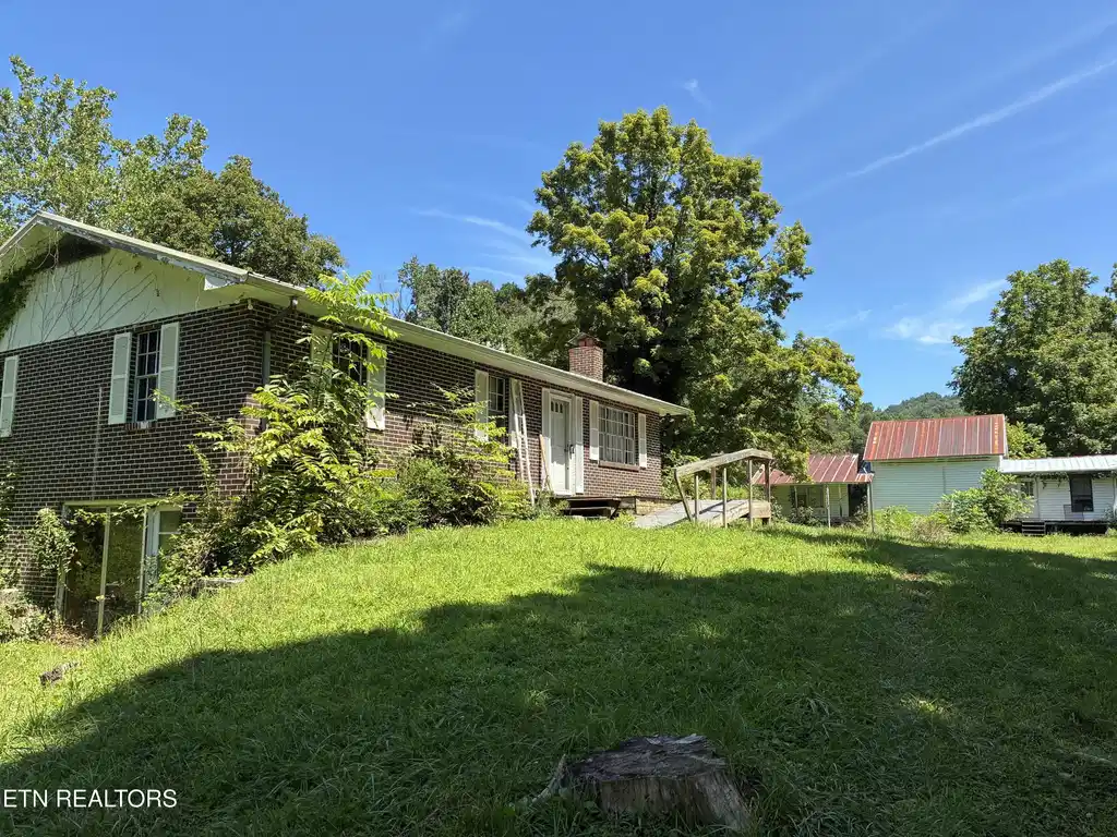 Image 1: Brick rancher and old farmhouse
