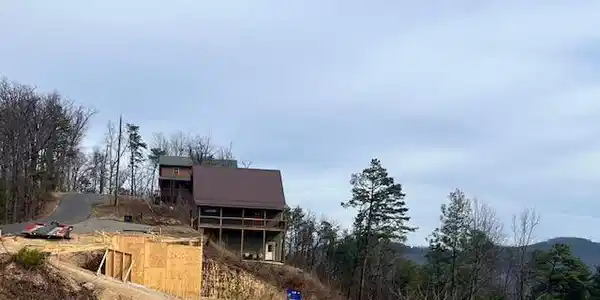 Image 4: View from lot to neighbor construction