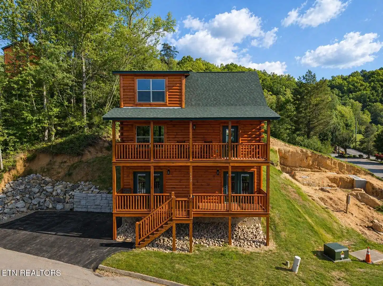 Image 1: Charming log cabin with mountain views.