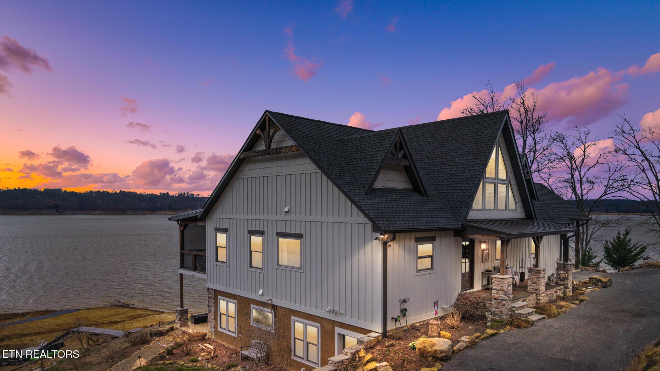 Image 2: Sunset View of the Lake Home