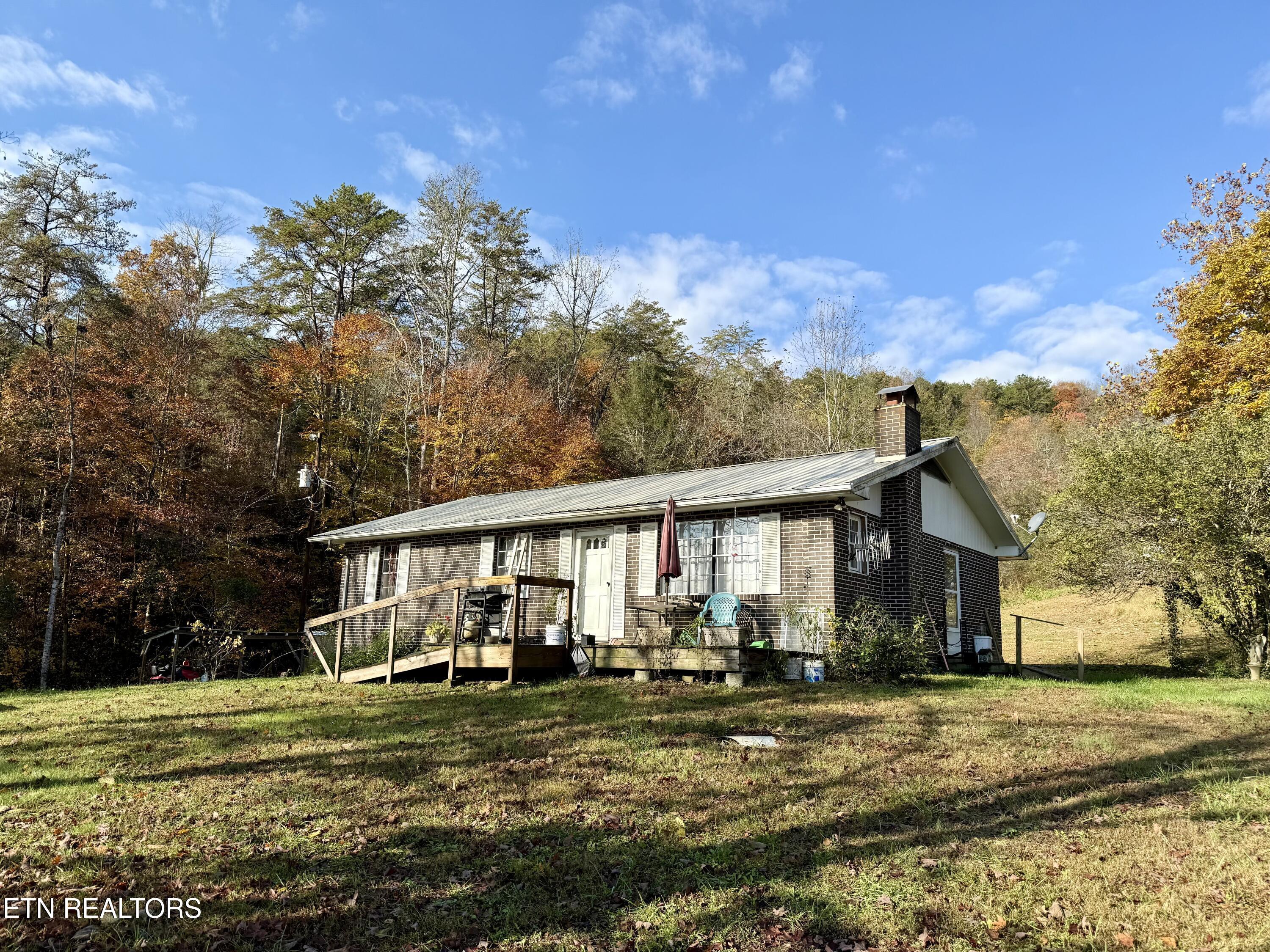 Image 4: Home #1 is the brick rancher