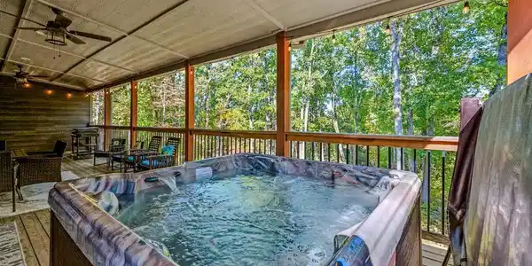 Image 2: covered deck area w hot tub